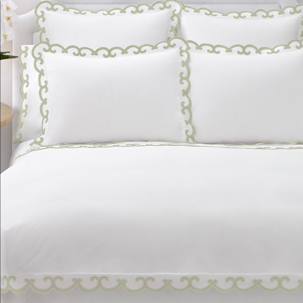 Aerin standard pillow sham with light green trim